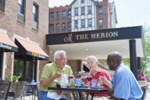 seniors enjoying lunch outside The Merion