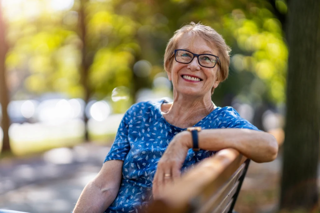 senior woman on park bench