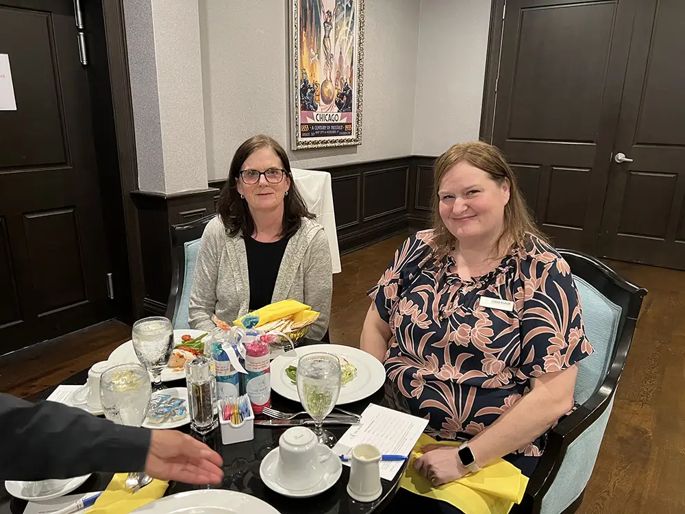 Diana, The New General Manager of The Merion enjoying a meal with residents
