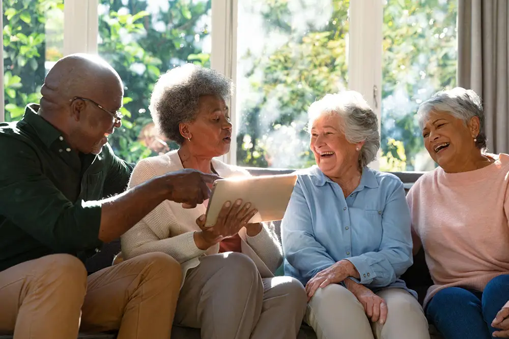 group of seniors smiling and laughing together