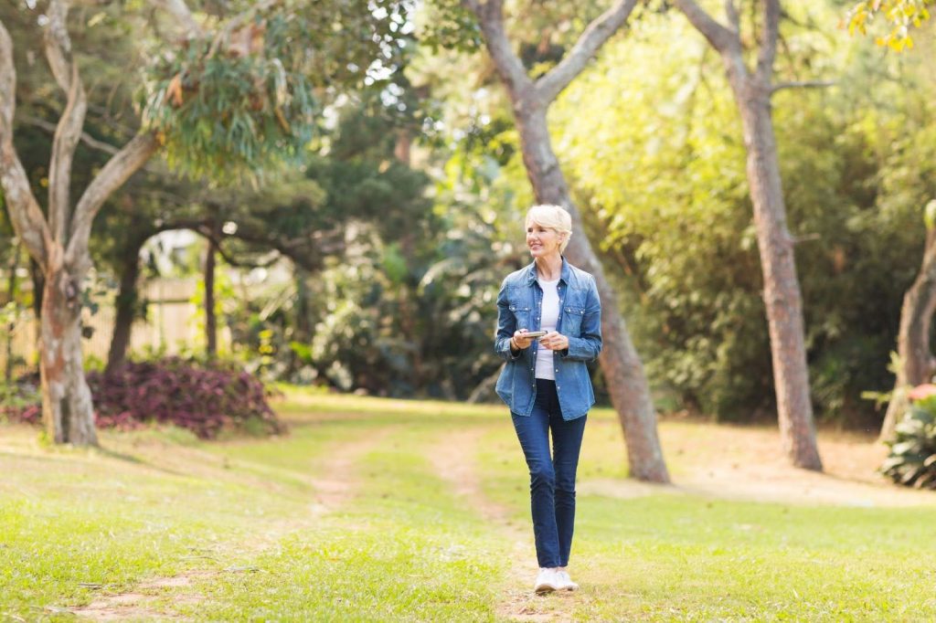 Senior woman enjoying a walk in a park